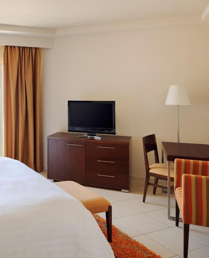 Naama Bay Promenade Beach Resort Managed By Accor Sharm el Sheikh Esterno foto A television in a hotel room